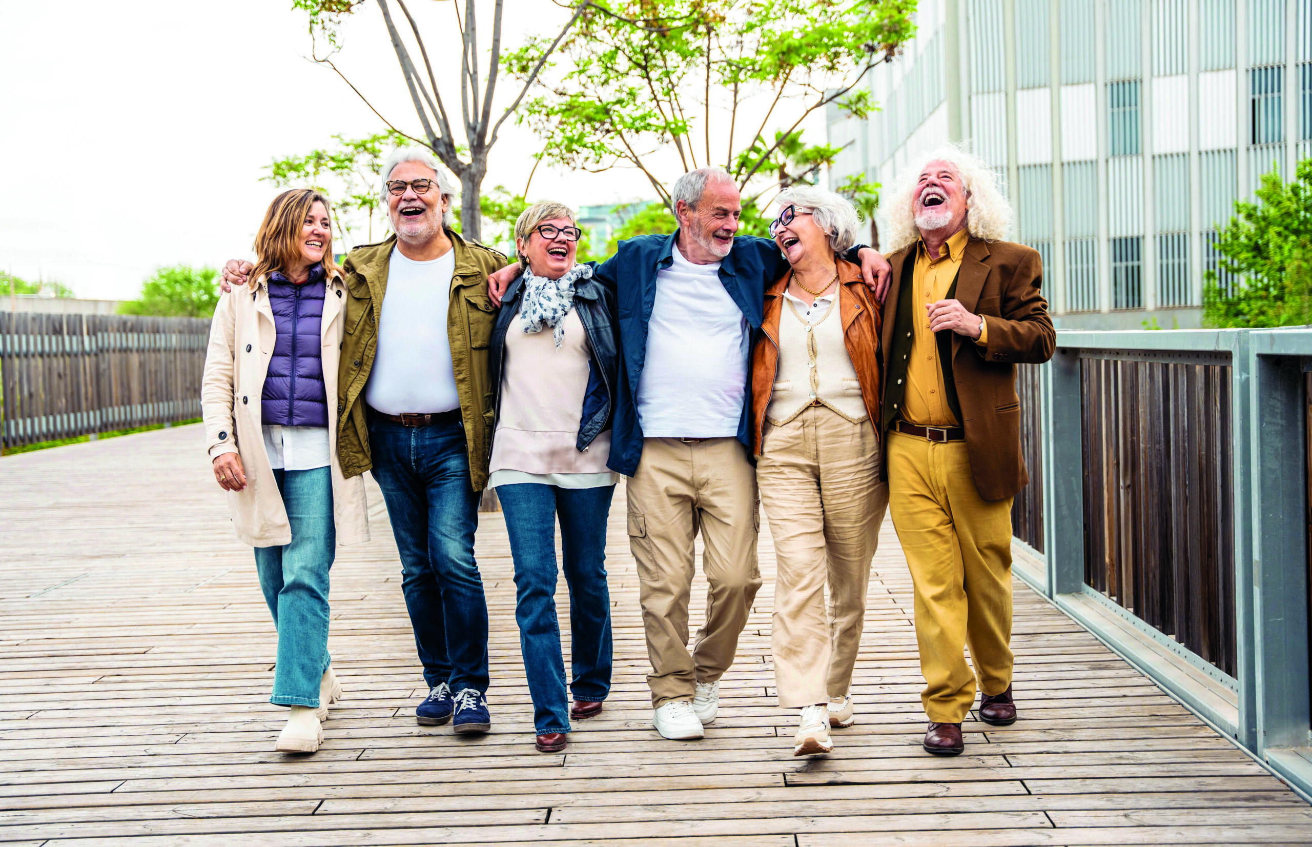 Happy,Group,Of,Senior,People,Walking,Outdoors,-,Laughing,Aged
